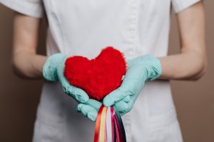 Holding your Heart in your Hands | Say "Hello" to a Healthy Heart: Three Effortlessly Cool Ways to Keep Your Ticker in Check | Concierge Health and Aesthetics | Sarasota, Florida